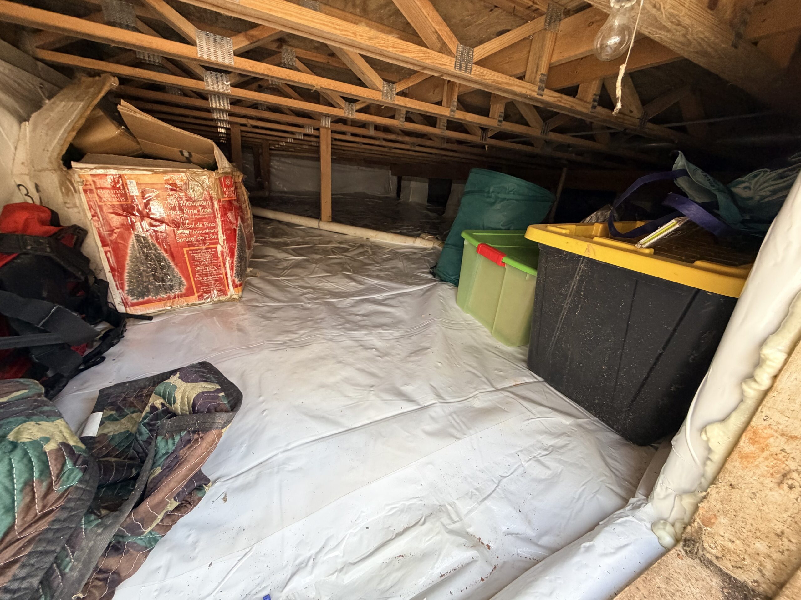 After crawlspace with sealed vapor barrier