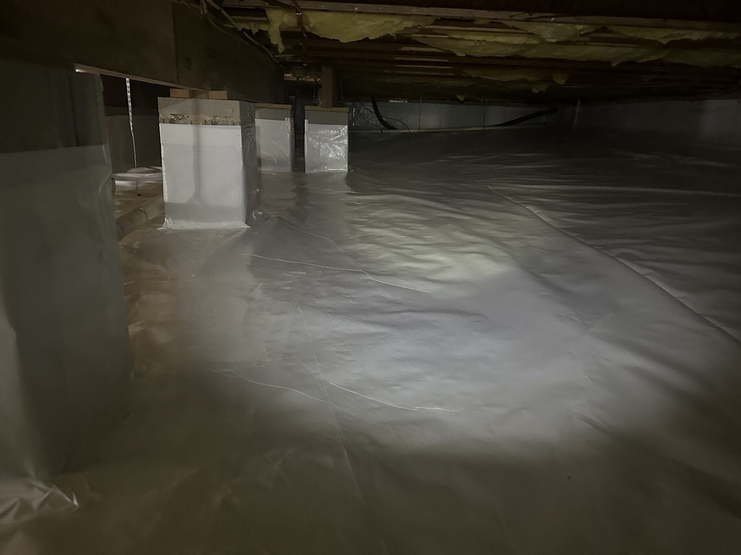 After crawlspace encapsulation with clean vapor barrier